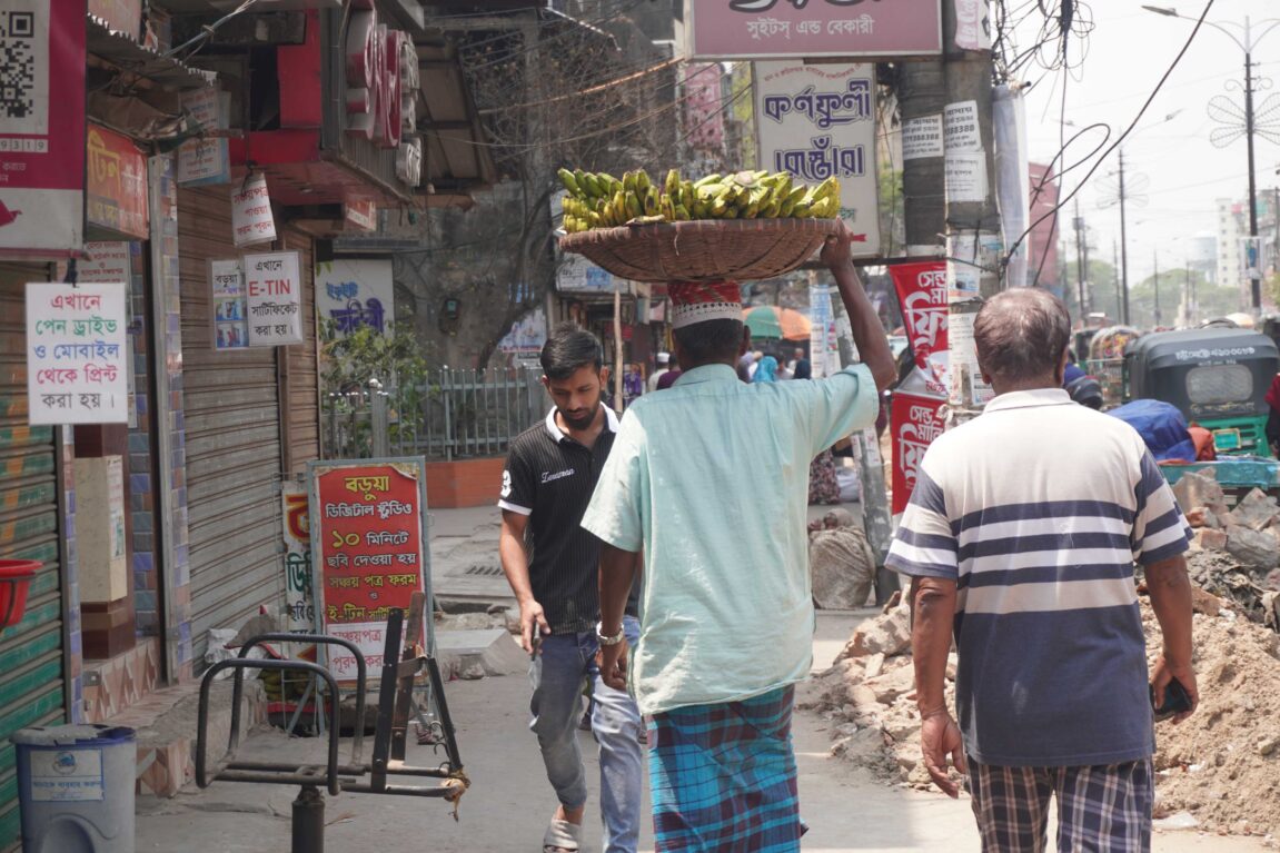 Men with fruits on their heads